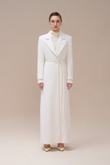 Textured wool-blend full-length coat with tailored notch lapels and adjustable waist tie