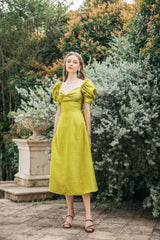 Silk midi dress with puff sleeves, sweetheart neckline, and fitted waist detail
