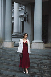 Tailored silk blazer with structured shoulders and notched lapel for refined layering