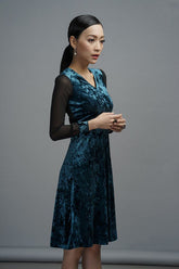 Velvet A-line dress with sheer mesh long sleeves and V-neckline for elegant evening wear