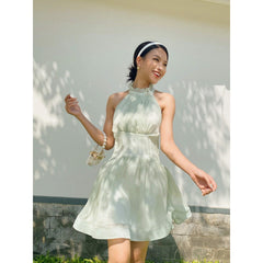 Sleeveless organza halter mini dress with tie-back detail and softly flared skirt