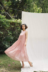 Sleeveless tiered midi dress in sheer organza with flowing silhouette and airy movement
