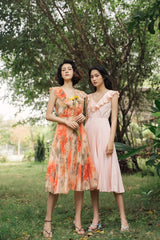 Pleated silk midi dress with ruffle neckline and soft-flowing sleeveless silhouette