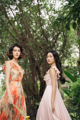 Pleated silk midi dress with ruffle neckline and soft-flowing sleeveless silhouette