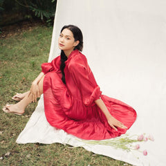 Flowy tiered mini dress in silk with gathered sleeves and soft V neckline