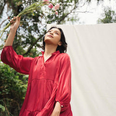 Flowy tiered mini dress in silk with gathered sleeves and soft V neckline