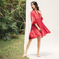Flowy tiered mini dress in silk with gathered sleeves and soft V neckline
