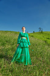 Silk blouse with long sleeves and open back design for elevated occasion wear styling