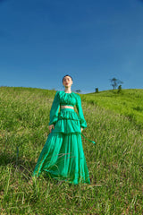 Tiered full-length silk skirt with flowing silhouette and ruched detailing for elegant movement