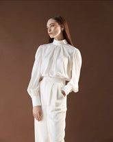 Silk blouse with high neckline, gathered bodice, and voluminous long sleeves