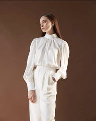 Silk blouse with high neckline, gathered bodice, and voluminous long sleeves