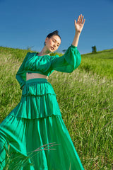 Tiered full-length silk skirt with flowing silhouette and ruched detailing for elegant movement