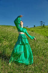 Tiered full-length silk skirt with flowing silhouette and ruched detailing for elegant movement