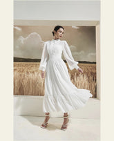 Long sleeve silk midi dress with pintuck bodice, gathered waist, and ruffle hem