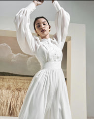 Long sleeve silk midi dress with pintuck bodice, gathered waist, and ruffle hem