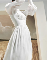 Long sleeve silk midi dress with pintuck bodice, gathered waist, and ruffle hem