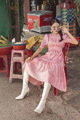 Silk midi dress with ruched bodice, puff sleeves, and flared tiered skirt