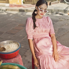 Silk midi dress with ruched bodice, puff sleeves, and flared tiered skirt