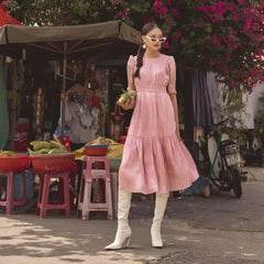 Silk midi dress with ruched bodice, puff sleeves, and flared tiered skirt