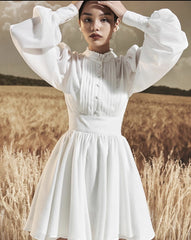 Mini silk dress with structured bodice, lantern sleeves, and flared pleated skirt
