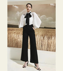 Pantalon large taille haute en soie avec silhouette structurée et finition élégante sur mesure