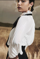 Sheer organza blouse with pleated bishop sleeves and oversized necktie bow detail