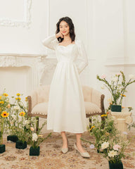 Silk midi dress with sweetheart neckline and long sleeves for romantic and refined elegance