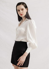 Silk mini skirt with tailored high waist and subtle textured weave for versatile styling