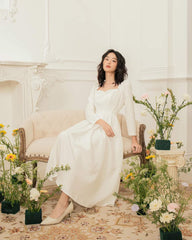 Silk midi dress with sweetheart neckline and long sleeves for romantic and refined elegance