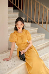 Robe midi en organza avec manches bouffantes, décolleté à volants et taille froncée pour une forme élégante