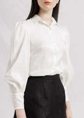 Silk mini skirt with tailored high waist and subtle textured weave for versatile styling
