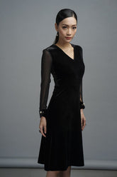 Velvet A-line dress with mesh long sleeves, V-neckline, and pearl-accented cuffs