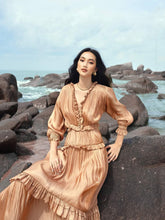 Pleated silk maxi dress with ruffle trim and shirred waist for graceful, full-length elegance