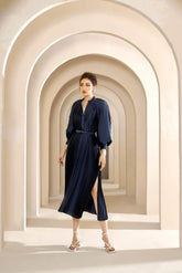 Pleated silk midi dress with belted waist and voluminous long sleeves