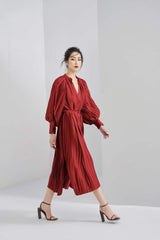 Pleated silk midi dress with long puff sleeves and V-neck wrap silhouette
