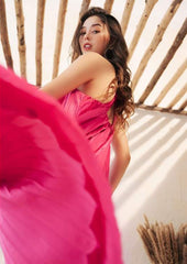 Sleeveless pleated silk halter dress with ring-back detail and flowy midi silhouette