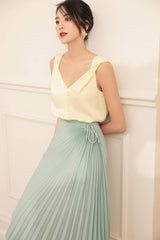 Sleeveless silk top with soft drape and V-neckline for refined day-to-night elegance