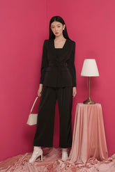 Tailored silk blazer with structured lapel and waist tie detail for modern formalwear