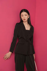 Tailored silk blazer with structured lapel and waist tie detail for modern formalwear