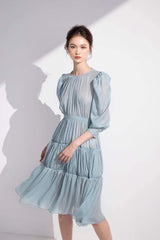 Tiered long-sleeve midi dress in sheer organza with gathered waist and puffed shoulder detail