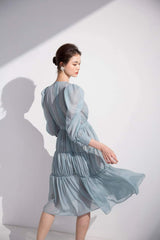 Tiered long-sleeve midi dress in sheer organza with gathered waist and puffed shoulder detail