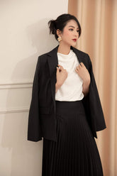 Tailored silk blazer with structured shoulders and minimalist single-breasted design
