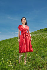 Silk midi dress with cinched waist and flutter sleeves in flowy silhouette for refined femininity