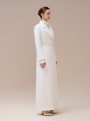Textured wool-blend full-length coat with tailored notch lapels and adjustable waist tie