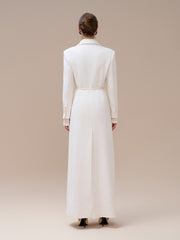 Textured wool-blend full-length coat with tailored notch lapels and adjustable waist tie