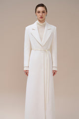 Textured wool-blend full-length coat with tailored notch lapels and adjustable waist tie