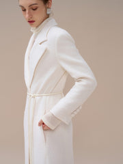 Textured wool-blend full-length coat with tailored notch lapels and adjustable waist tie