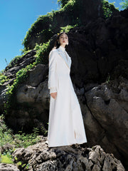 Textured wool-blend full-length coat with tailored notch lapels and adjustable waist tie