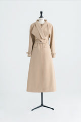Tailored wool blend trench coat with oversized lapels and structured belted waist