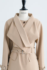 Tailored wool blend trench coat with oversized lapels and structured belted waist